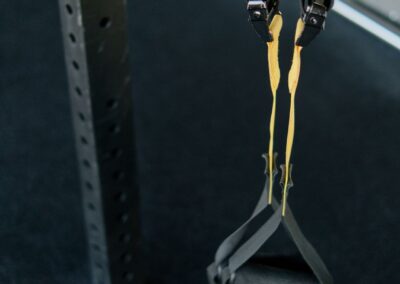 Close-up of a suspension trainer at a gym, perfect for fitness enthusiasts seeking versatile workouts.